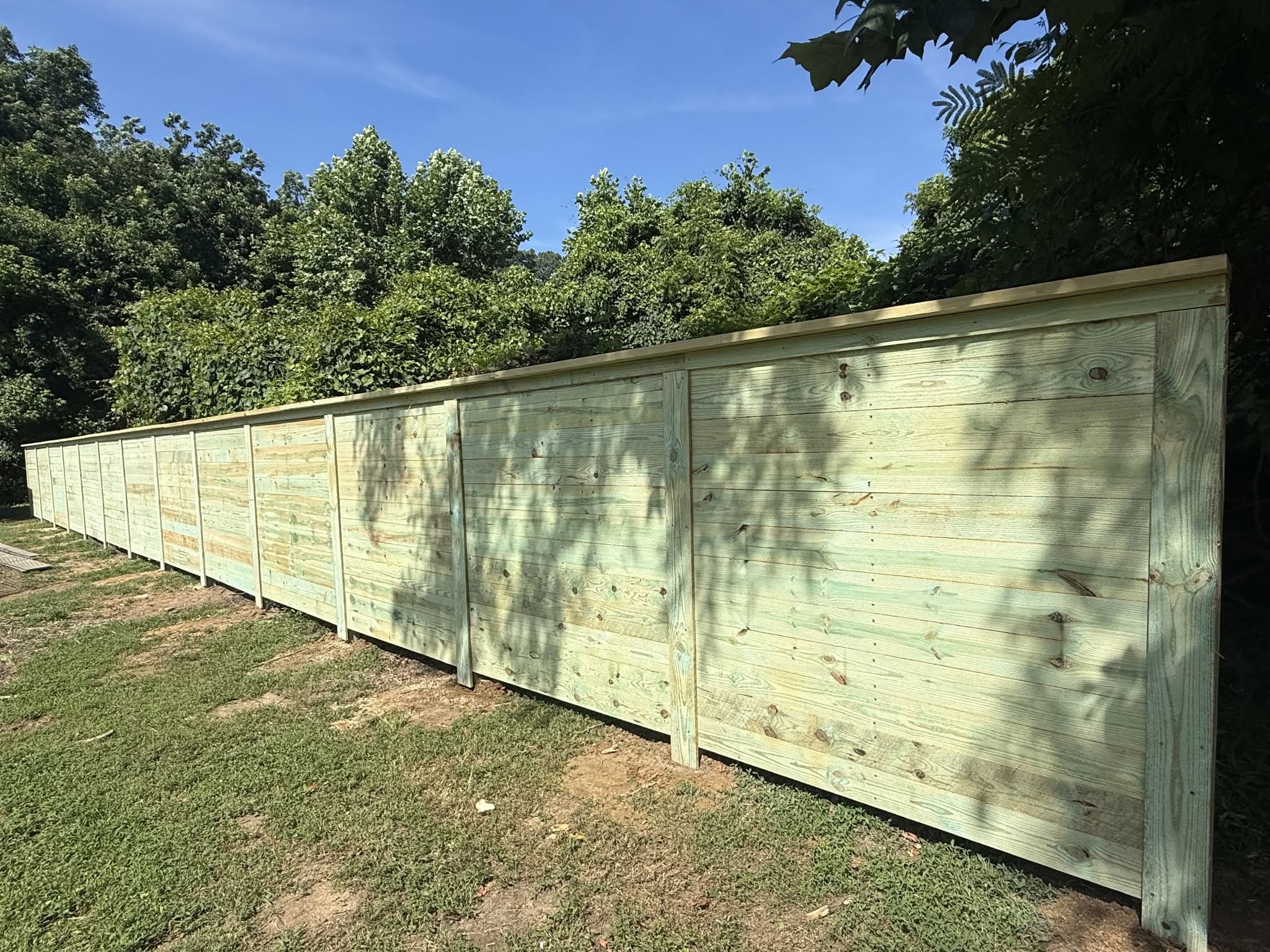 731 Deck & Fence LLC crew at work on a fence job